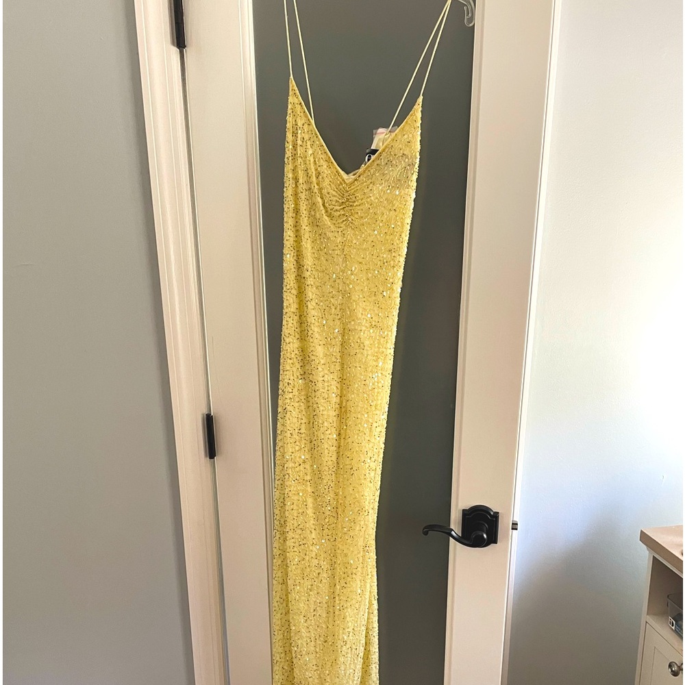 Spaghetti strapped gown . Slinky floor length